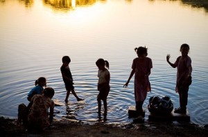 children play in water in the summer