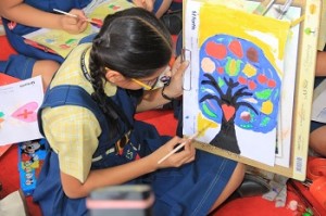 School girl drawing healthy diet at Fortis Hospital Health Mela 2015.
