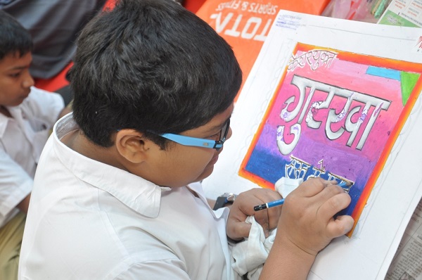 School children paint to spread cancer awareness